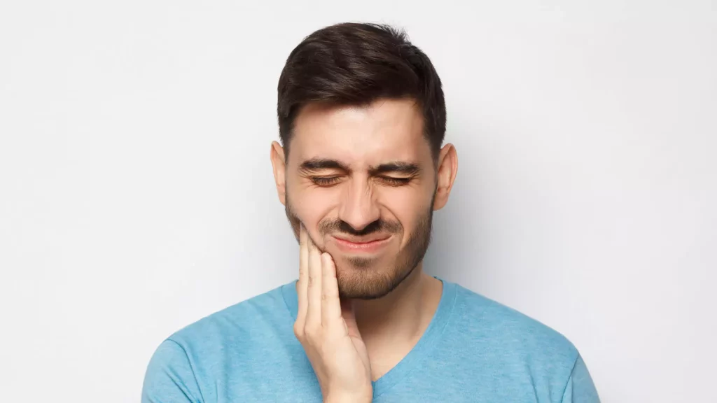 Man experiencing tooth pain.
